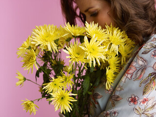 Closeup on relaxed woman on pink