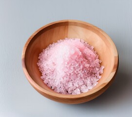 pink salt in a bowl on a white background.