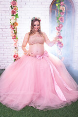 Fototapeta premium Pregnant princess on the tree swing