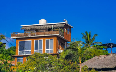 Fototapeta na wymiar Hotels buildings houses in tropical paradise in Puerto Escondido Mexico.