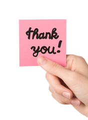Woman holding pink paper note with phrase Thank You isolated on white, closeup