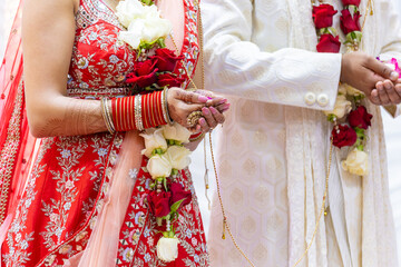 Fototapeta na wymiar Indian Hindu wedding ceremony rituals bride and groom's hands close up