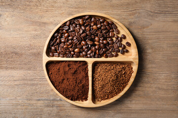 Instant, ground coffee and roasted beans on wooden table, top view