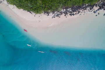 Aerial view of a beach with calm smooth waves on the Gold Coast