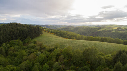 View of a valley with forest and hills near Conques, Aveyron, France
