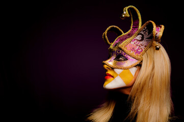 close up portrait of beauty young woman in venice mask