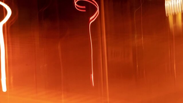 Urban street electricity lights time lapse in loop. Abstract background texture timelapse stop motion. Seamless long exposure and blurred motion animation, experimental abstraction in motion.