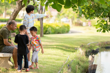 Asian Kids playing at playground outdoor with happy smile