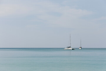 Fototapeta premium Island and boats on blue sky with clouds over the sea, wallpaper, background. 