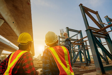 Asian Civil Engineer standing Inspects the Bridge Structure Around the City.