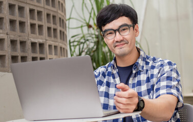 asian man work using computer hand typing laptop keyboard contact us.student study learning education online.adult professional people chatting search at office.concept for technology device business