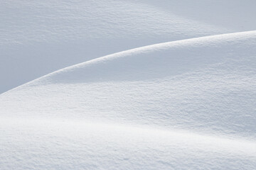 Abstract curves and shadows in winter snow background