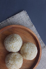 Onde-onde is a traditional Indonesian snack that is round in shape sprinkled with sesame seeds and filled with peeled green beans