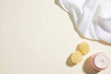 Obraz premium composition of bathroom object on light beige background. simple, copy space. top view.