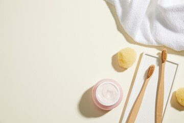 composition of bathroom object on light beige background. simple, copy space. top view.