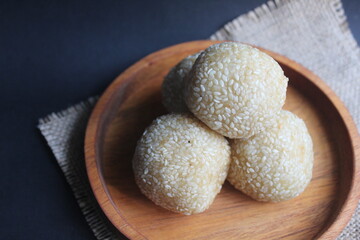 Onde-onde is a traditional Indonesian snack that is round in shape sprinkled with sesame seeds and filled with peeled green beans