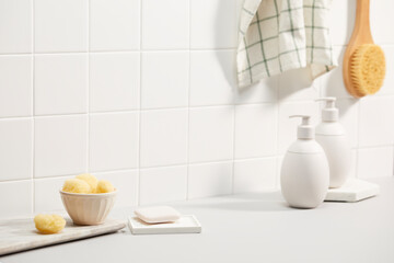 Naklejka na ściany i meble bathroom with white tile wall and bath objects. space for text, copy space