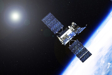 Space communications satellite above the earth. Elements of this image furnished by NASA