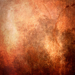 Photo artistic background blending textures and colors of brown, orange, yellow and tan for a studio wallpaper.