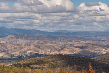 Beautiful view of the large Mexican city of Oaxaca from Monte Alban. View of the endless mountain peaks.