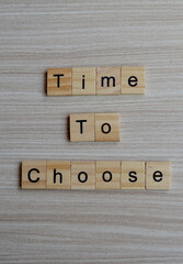 time to choose text on wooden square, inspiration quotes