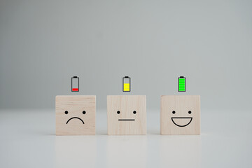 Energy life and emotion level. Happy smile face with full battery and unhappy face low battery on...