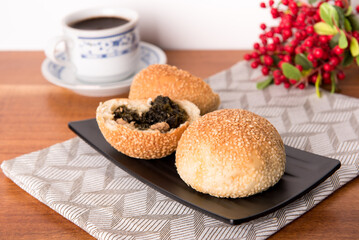 Kompyang bread or Kompia or Guang Bing, a typical Chinese bread that is popular in Indonesia, both filled with meat and empty. Its signature with a sprinkling of sesame on top