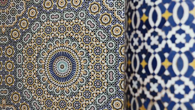 Moroccan zellige mosaic pattern in traditional Islamic geometric design in Morocco. Made with natural colors from indigo, saffron, mint, kohl. 4k Moroccan design background footage changing focus fore