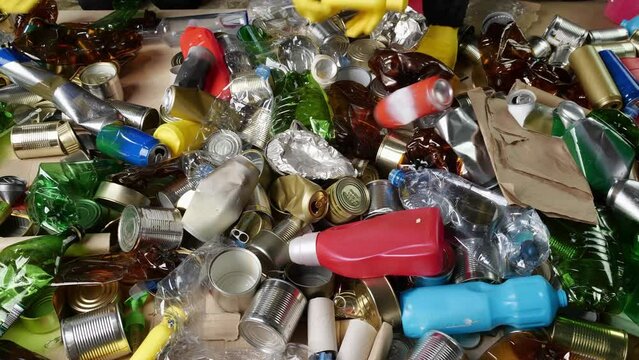 Sorting and Recycling Facility. Manual Seperation of recyclable plastic, aluminum, glass, paper, cartons, and cardboard