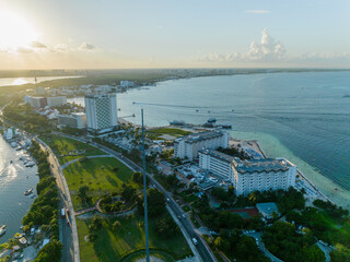 Fototapeta premium Aerial view of the beautiful coastline of Cancun, Mexico. Hotel zone. Sunset.