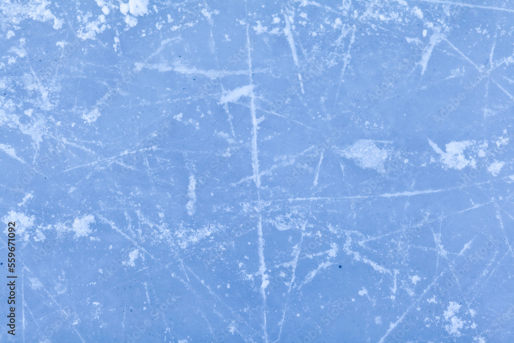 Poster empty ice rink with skate marks after the session outdoor. skating ice rink texture covered with sno