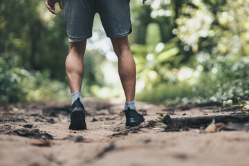 healthy lifestyle young fitness man running the forest. Outdoor workout,  Healthy lifestyle concept.