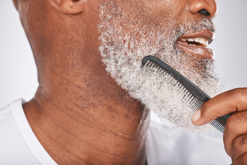Elderly, black man with comb for beard, beauty and grooming closeup with face hygiene and cosmetic care profile. Hair care, brush body hair and treatment with cosmetics against studio background - obrazy, fototapety, plakaty