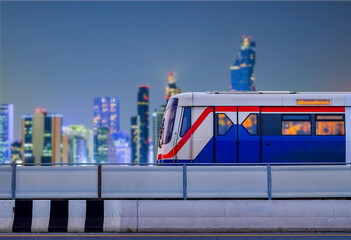 Bangkok SkyTrain stops on train tracks with blurred city background on night scene and copy space, Sky Train is a mass transit system in Bangkok to assist facilitate and fast journey