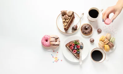 Fotobehang Table with various cookies, donuts, cakes,  coffee cups on white  background. © bit24