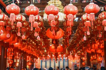 Chinese red Lanterns in temple, happy Lunar New Year holiday. Chinese sentence means happiness,...