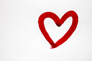A heart-shaped brush represents the meaning of Valentine's Day. on white paper
