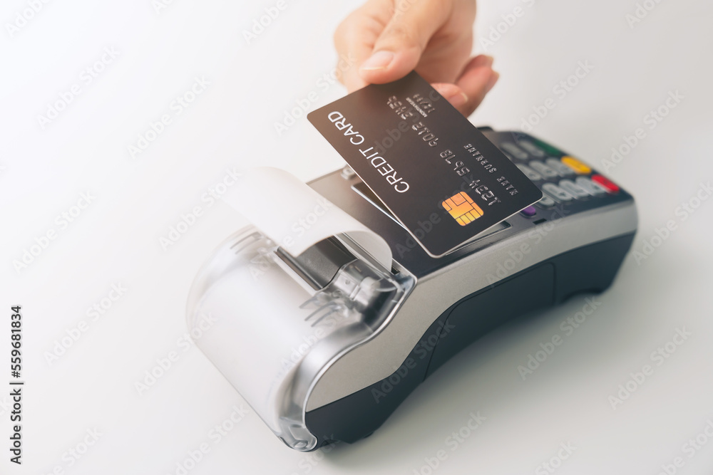 Poster customer using credit card for payment by nfc technology on card reader machine.