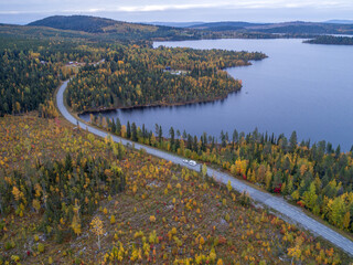 drone footgage Car Camping Caravan driving road lake Swedish Lapland fall ruska colors National Park Sweden - 559682018
