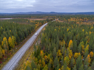 drone footgage Car Camping Caravan driving road lake Swedish Lapland fall ruska colors National Park Sweden