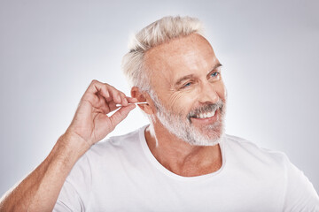 Elderly man, ear cleaning with cotton swab for hygiene, grooming and clean body with cosmetic care...