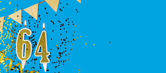 Golden candle number sixty four. Birthday or anniversary card with the inscription 64 on blue background. Anniversary celebration. Banner.