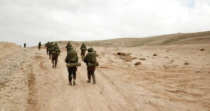 IDF Soldier from Israel Walking During Military Operation in Desert