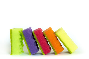 Stack of many multi-colored dish wash sponges isolated on white background. Household cleaning scrub pad. Home cleaning concept. Space for text