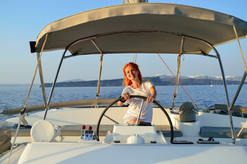 Woman sailing in the yacht