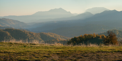 Backplate,for CGI production:roadside with visible car tracks against the background of mountains