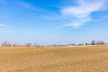 Fototapeta na wymiar Newly sown fields and farms in the countryside