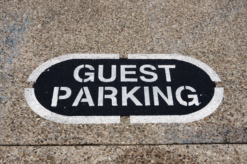 GUEST PARKING sign on a parking lot