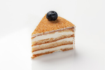 Slice of jaconde sponge cake with mascarpone whipped cream