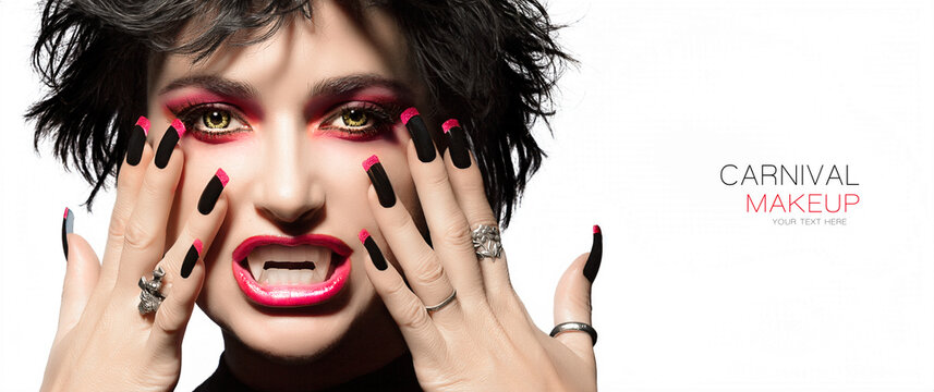 Carnival Beauty and Makeup Concept. High fashion portrait. Sexy vampire woman with gothic make up, georgeous smoky eyes in red to match lipstick and manicured nails with black and red nail art design